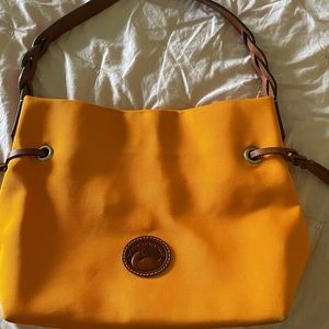 Authentic Dooney & Bourke orange canvas shoulder bag.